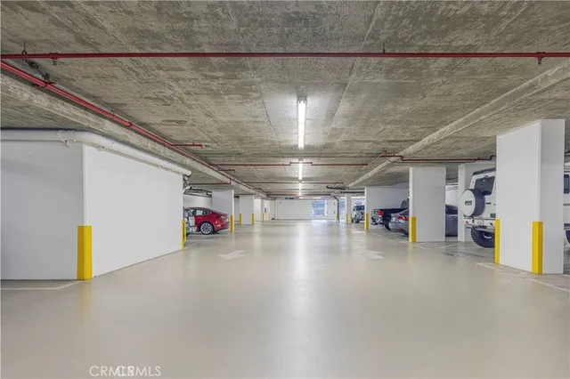 a living room with furniture wooden floor and a large window