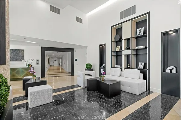 a view of entryway with furniture and a rug