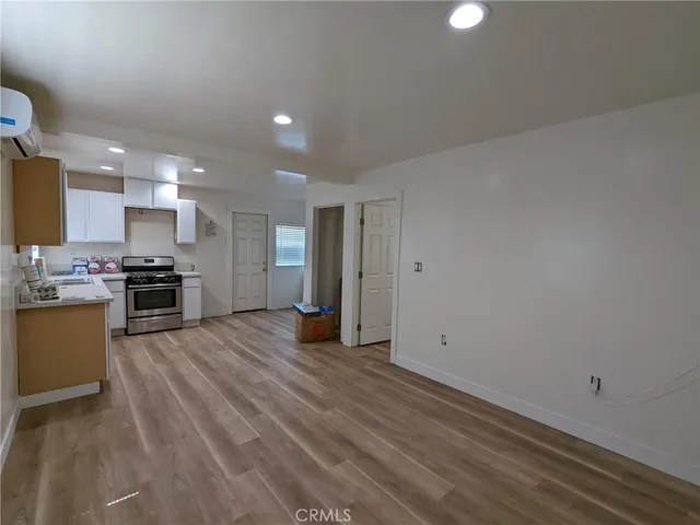 a view of kitchen with wooden floor
