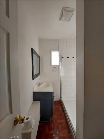 a hallway with a table and chairs