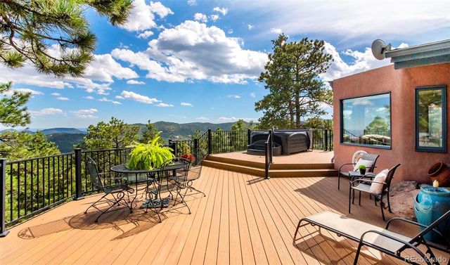 a view of a terrace with furniture