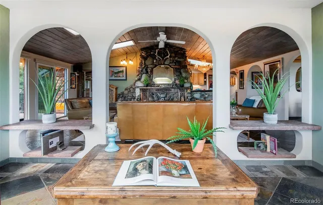 a view of living room with furniture and a floor to ceiling window