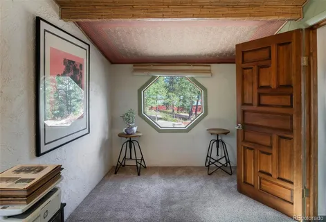 a view of room with window and furniture
