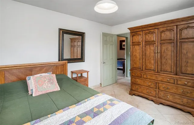 a bedroom with a bed and furniture