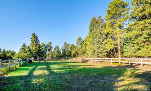 a view of a golf course with a trees