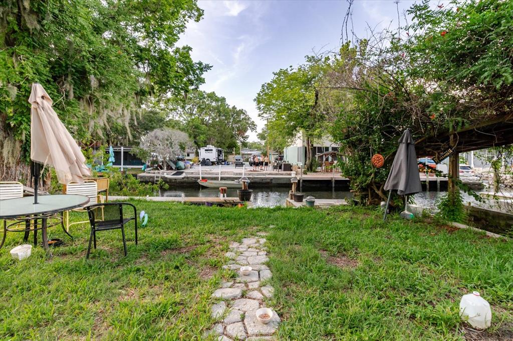 5323 Circle Drive Weeki Wachee, FL 34607 - Photo 66 of 77 a view of a house with backyard and sitting area
