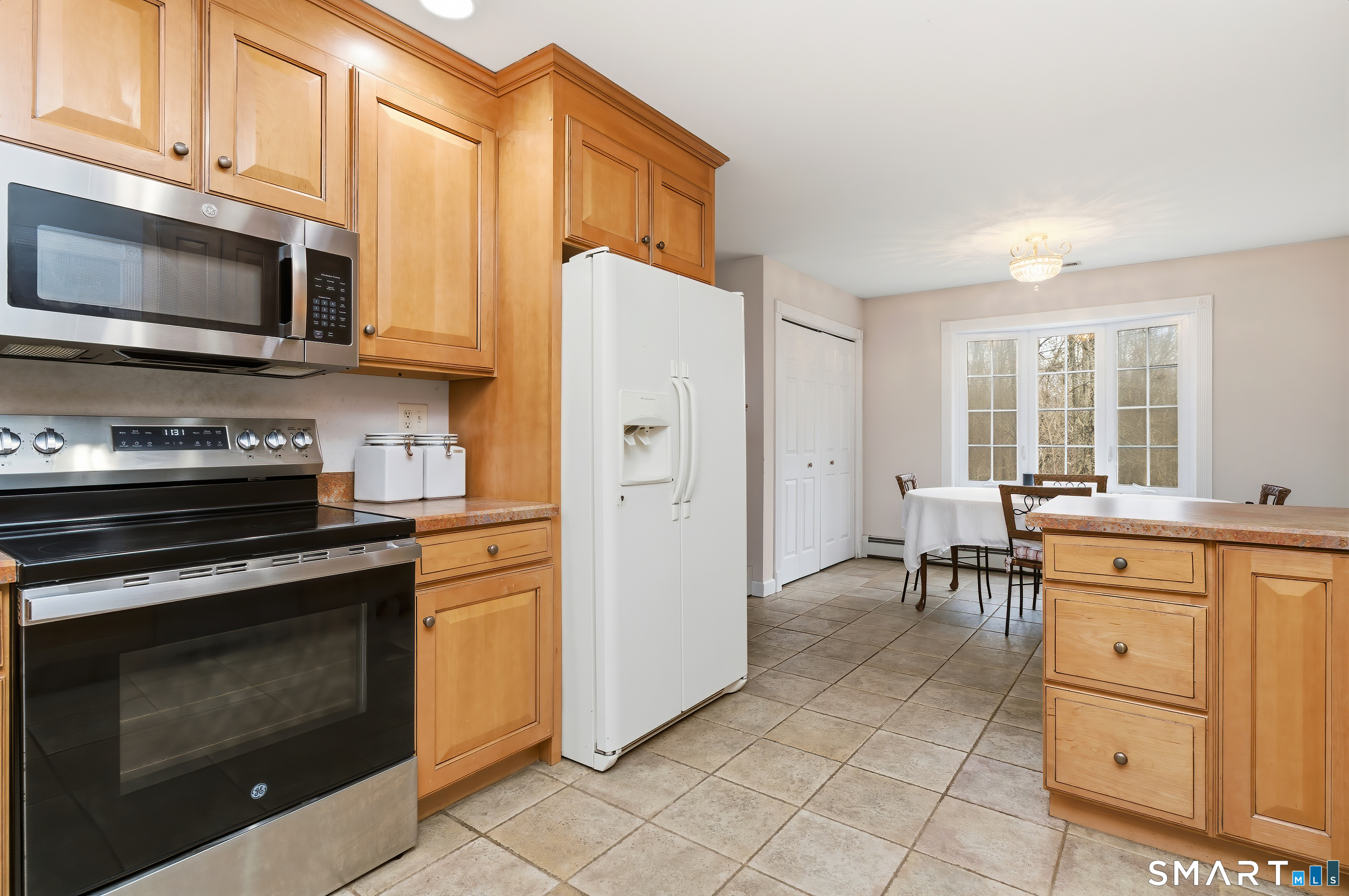4 Chatfield Street Seymour, CT 06483 - Photo 14 of 39 a kitchen with stainless steel appliances a stove a microwave and cabinets