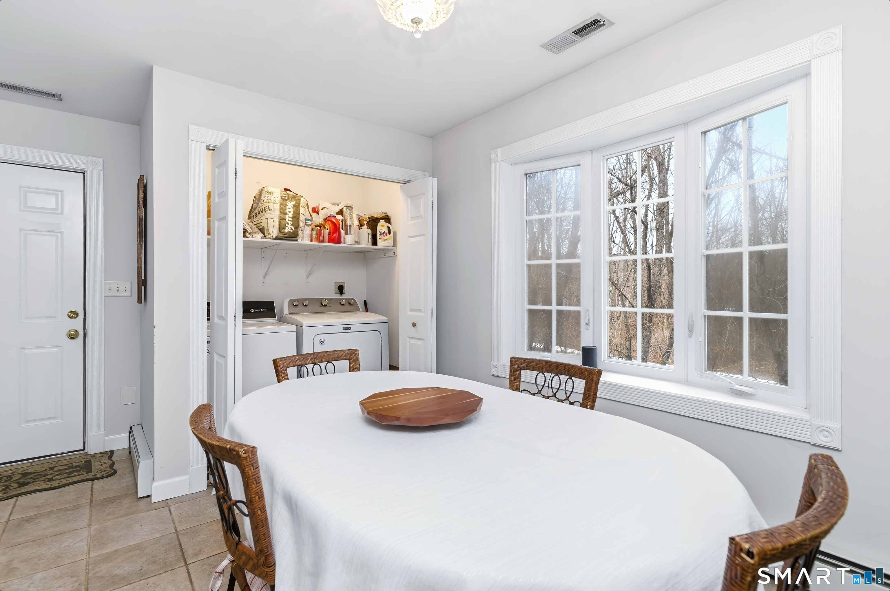 4 Chatfield Street Seymour, CT 06483 - Photo 19 of 39 a kitchen with a table chairs and a refrigerator