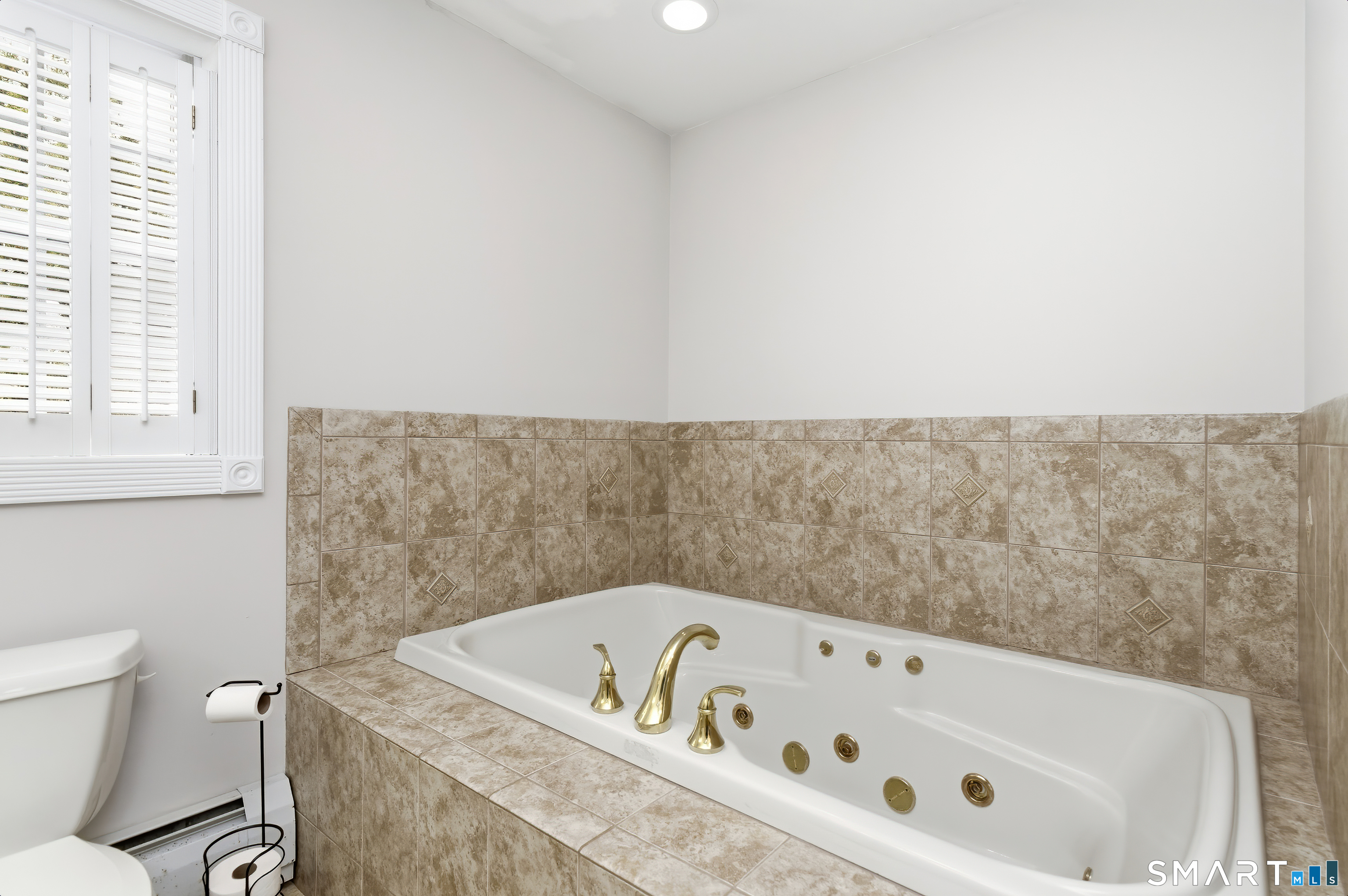 4 Chatfield Street Seymour, CT 06483 - Photo 25 of 39 a bathroom with a bathtub and a toilet