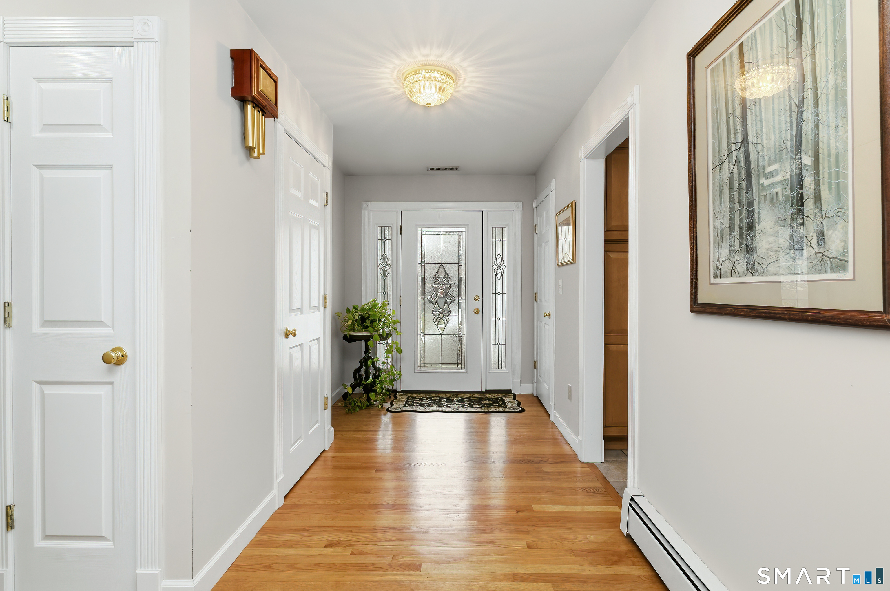4 Chatfield Street Seymour, CT 06483 - Photo 29 of 39 a view of a hallway with wooden floor and staircase