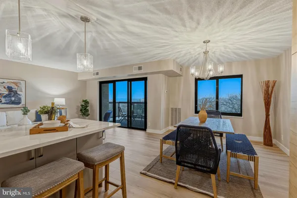 a living room with furniture a window and a ceiling fan