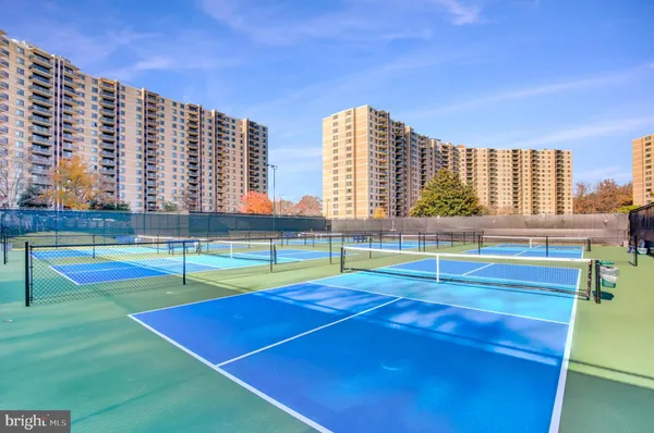 a view of an outdoor space and tennis court