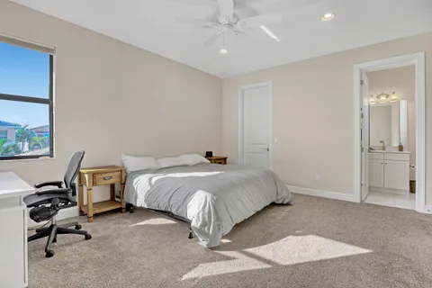 a bathroom with a toilet a sink and a mirror