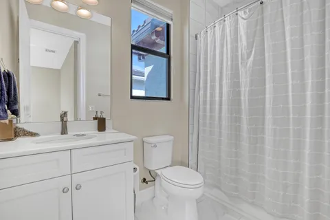 a bedroom with furniture and a window