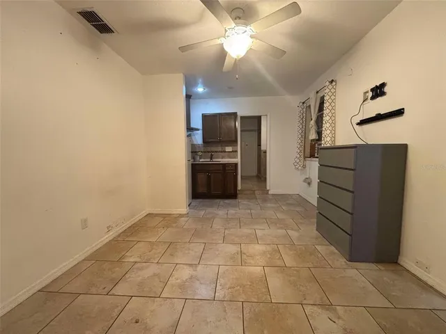 a kitchen with a cabinets and a stove top oven