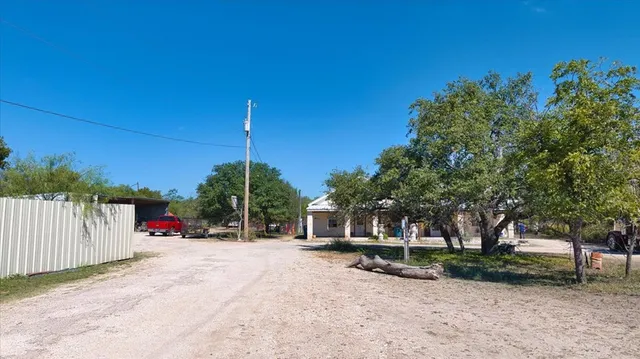 a view of outdoor space with garden and trees