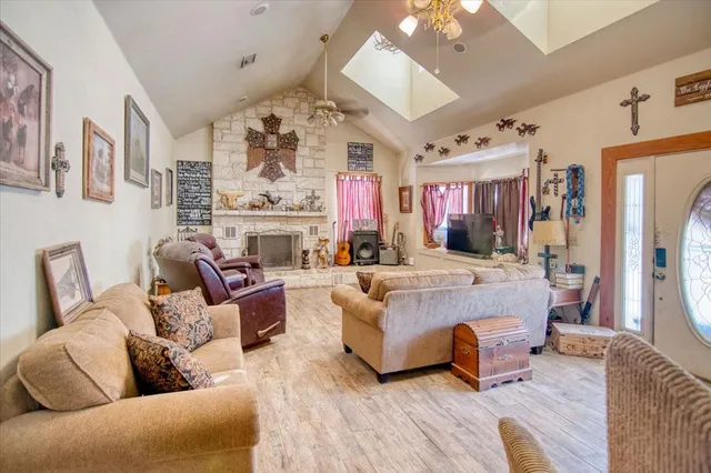 a living room with fireplace furniture and a flat screen tv