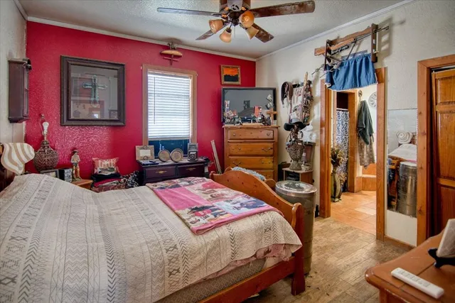 a bedroom with bed and a window