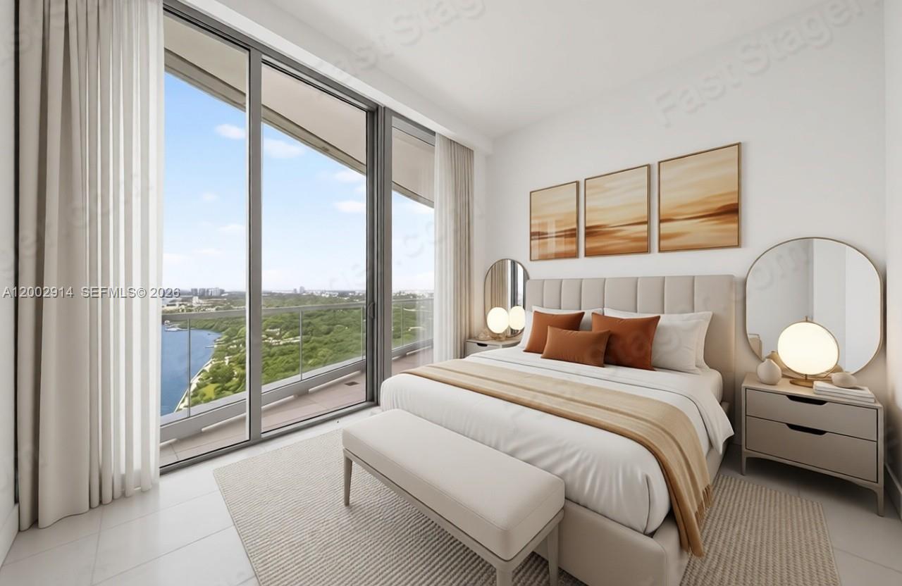 175 Southeast 25th Road, Unit 2602 Miami, FL 33129 - Photo 19 of 74 a bedroom with a large bed and a large window