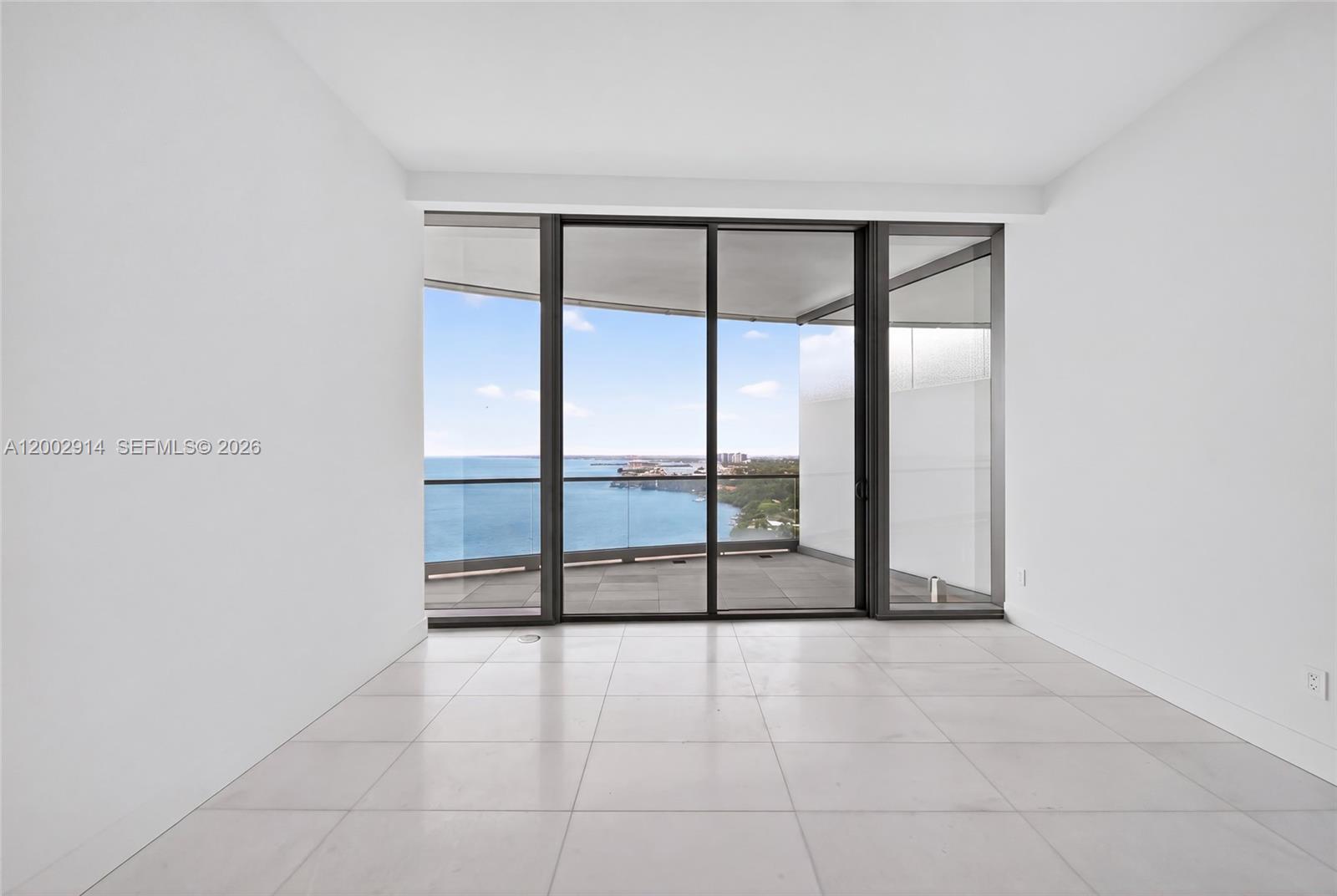 175 Southeast 25th Road, Unit 2602 Miami, FL 33129 - Photo 22 of 74 a view of an empty room with a large window