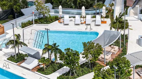 a view of swimming pool and fire pit