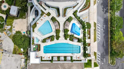 a view of a swimming pool with a lounge chair