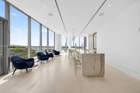 a view of a swimming pool with outdoor seating