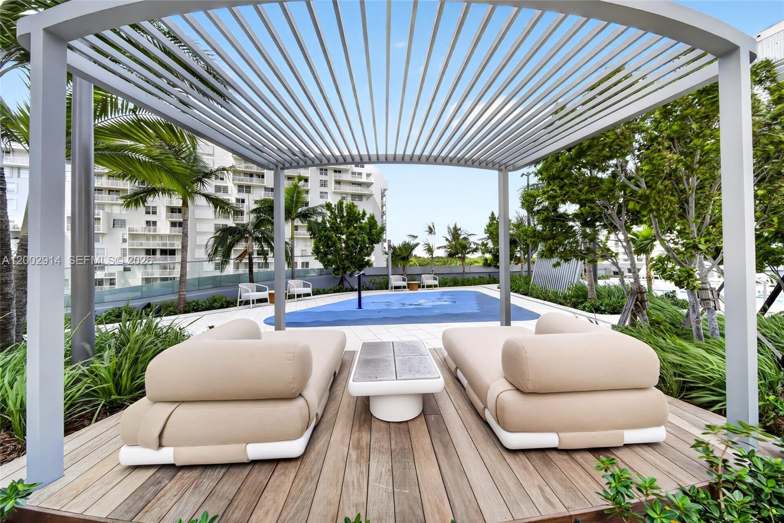 175 Southeast 25th Road, Unit 2602 Miami, FL 33129 - Photo 49 of 74 a view of a patio with couches table and chairs and potted plants