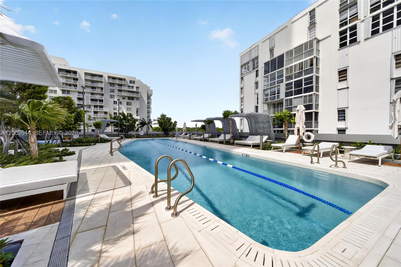 175 Southeast 25th Road, Unit 2602 Miami, FL 33129 - Photo 58 of 74 a view of a swimming pool with outdoor seating
