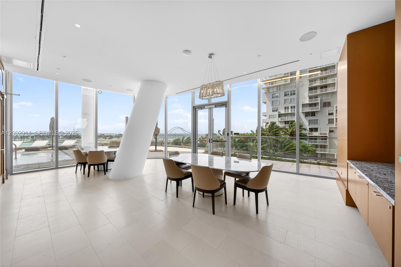175 Southeast 25th Road, Unit 2602 Miami, FL 33129 - Photo 63 of 74 a dining room with furniture and a floor to ceiling window