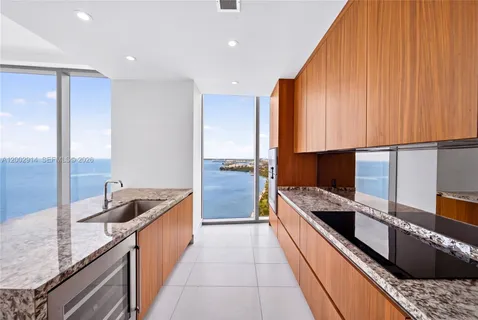 a view of kitchen with kitchen island wooden floor