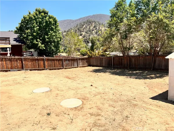 a view of swimming pool with a yard