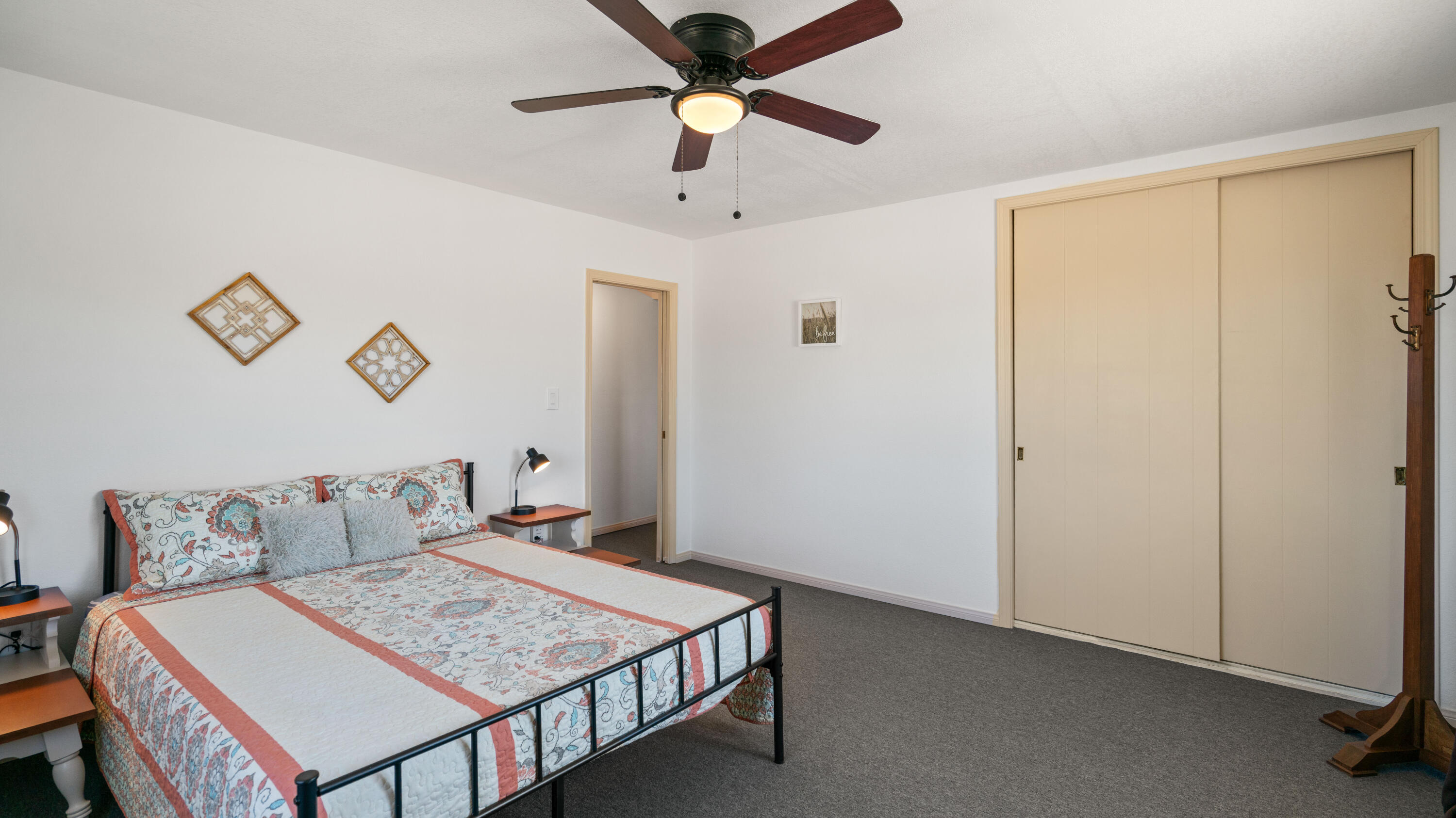 5096 Old Woman Springs Road Johnson Valley, CA 92285 - Photo 11 of 42 a bedroom with a bed and a chandelier
