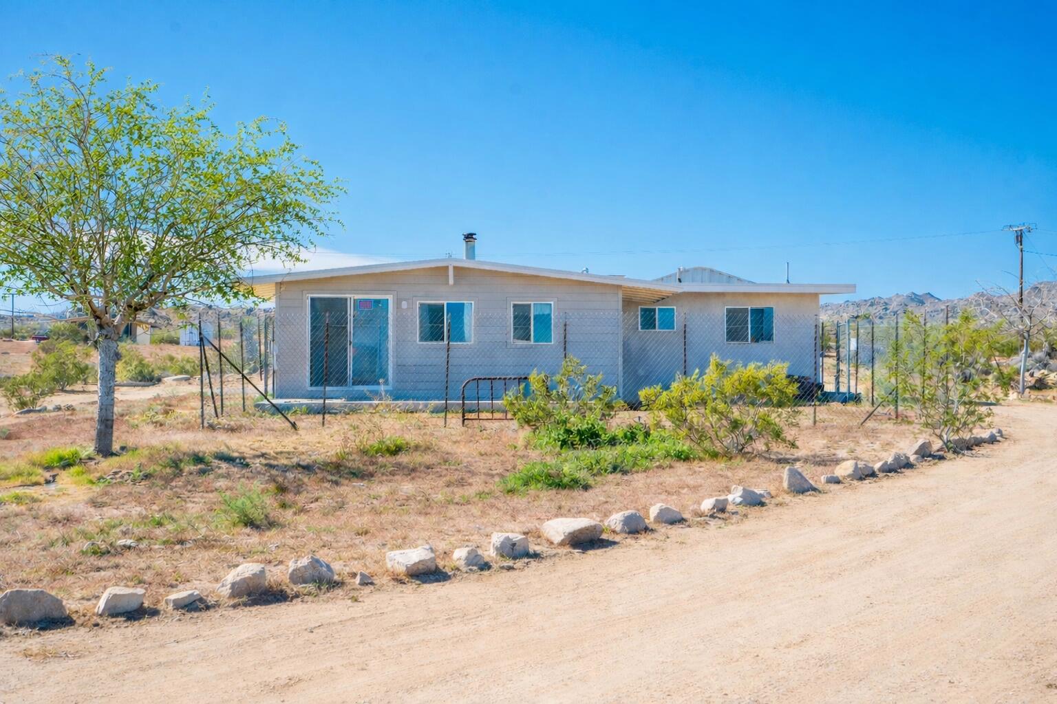5096 Old Woman Springs Road Johnson Valley, CA 92285 - Photo 30 of 42 a front view of a house with a yard
