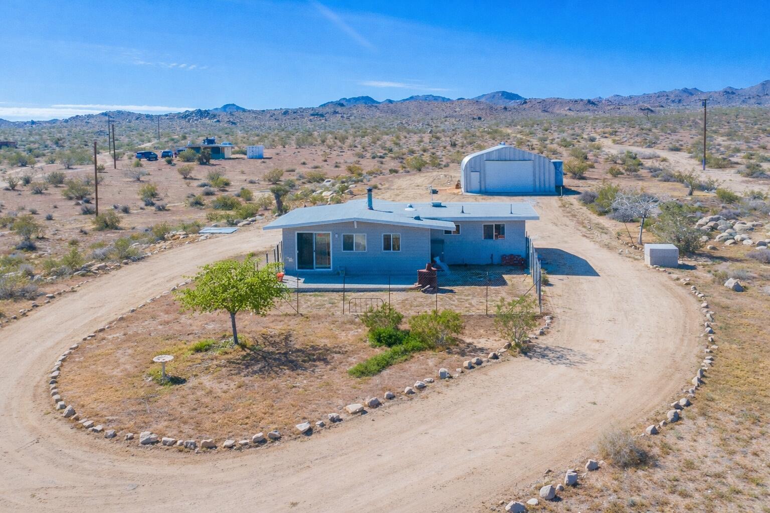5096 Old Woman Springs Road Johnson Valley, CA 92285 - Photo 31 of 42 an aerial view of a house with a yard