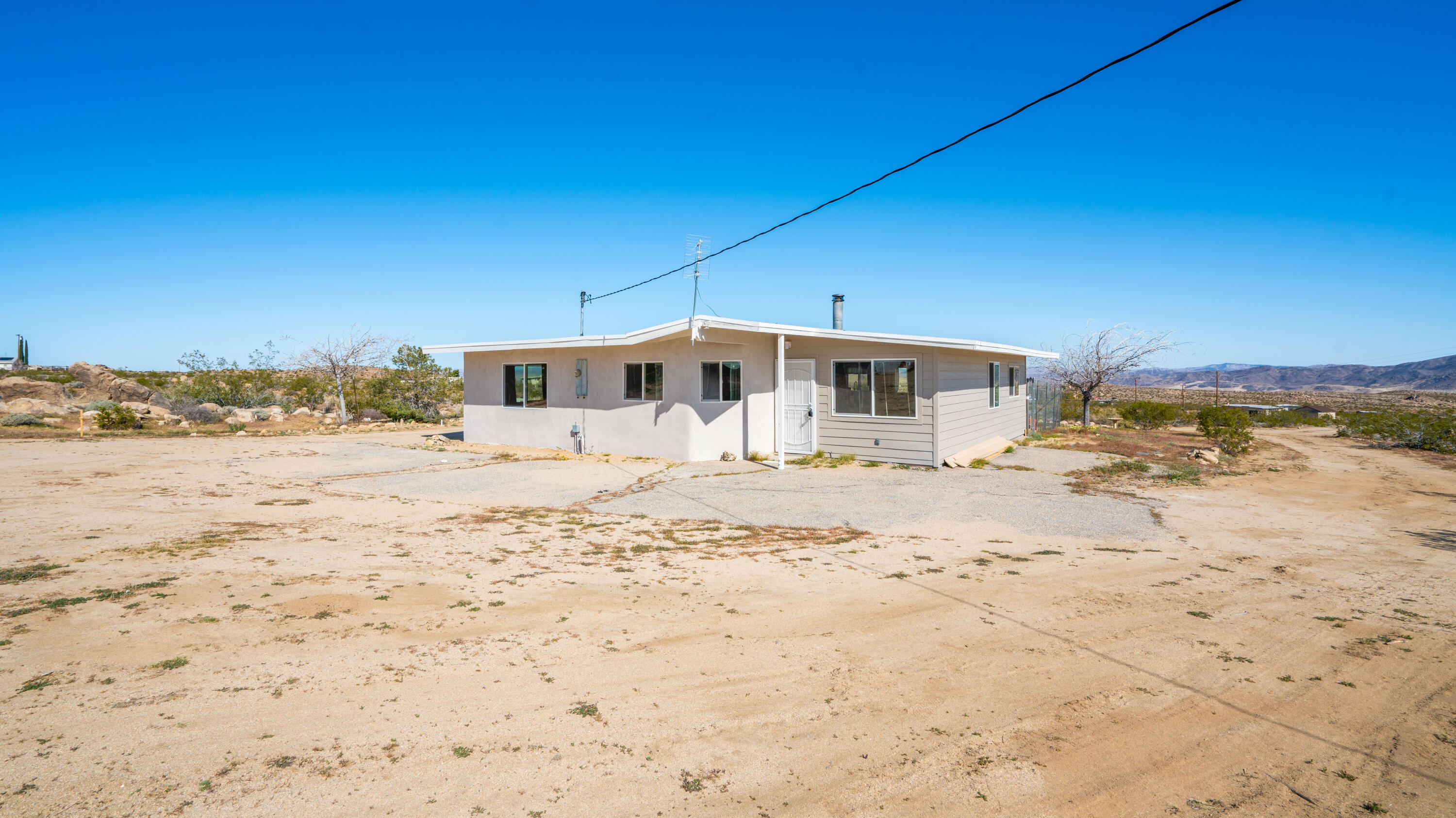5096 Old Woman Springs Road Johnson Valley, CA 92285 - Photo 34 of 42 a view of a house with a yard