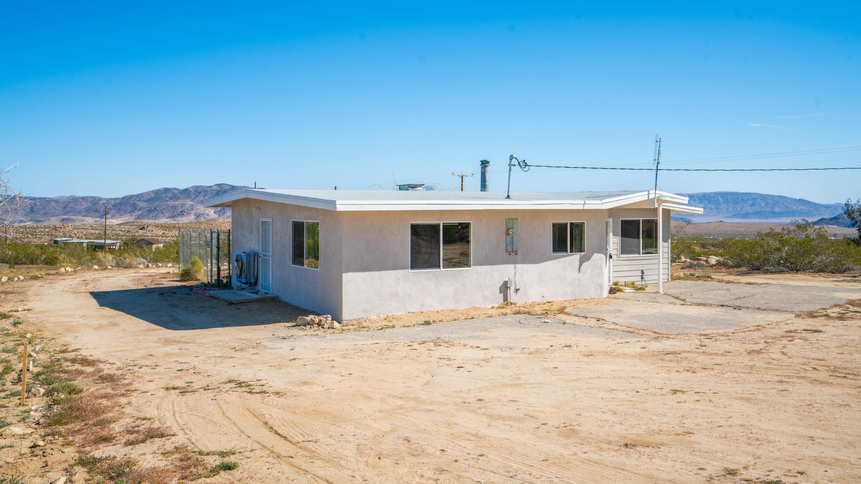 5096 Old Woman Springs Road Johnson Valley, CA 92285 - Photo 38 of 42 a front view of a house with a yard