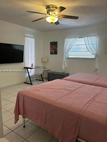 a bathroom with a toilet sink and shower
