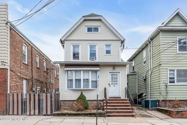 a front view of a house with street