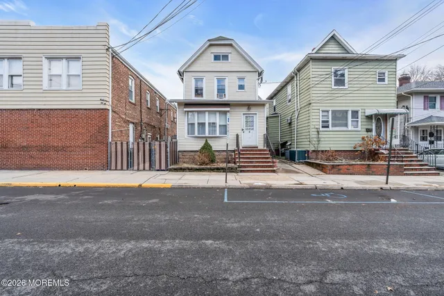 a view of a house with a street
