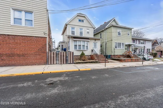 a view of multiple houses with a street