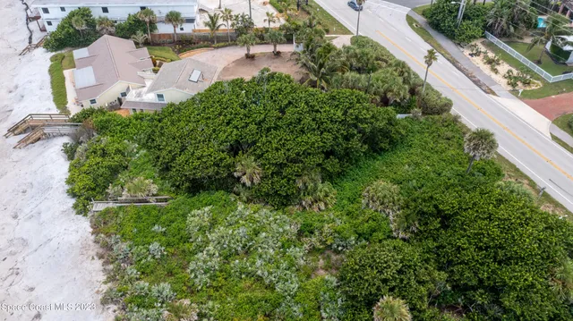 an aerial view of residential house with outdoor space and street view