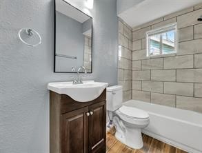 5911 Grace Lane, Unit 2 Houston, TX 77021 - Photo 4 of 7 a bathroom with a sink toilet and shower