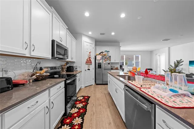 a view of an ocean & house with a swimming pool