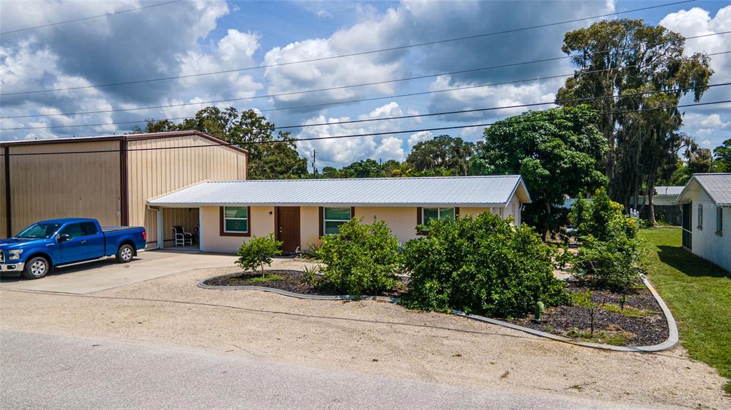 801 Spruce Street Englewood, FL 34223 - Photo 1 of 1 a front view of a building with garden