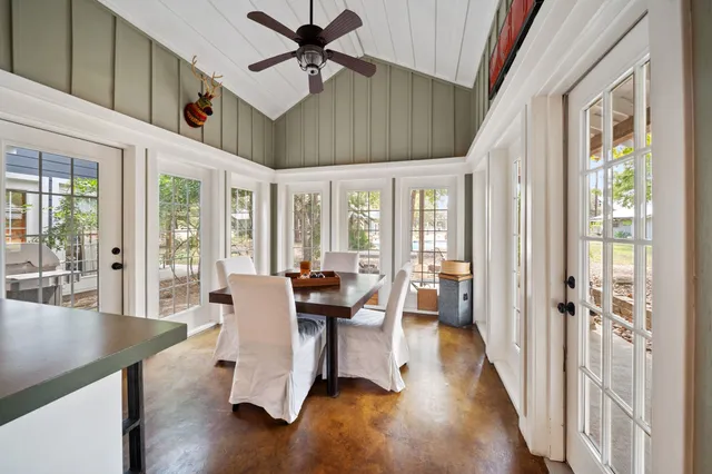 a swimming pool with outdoor seating and yard