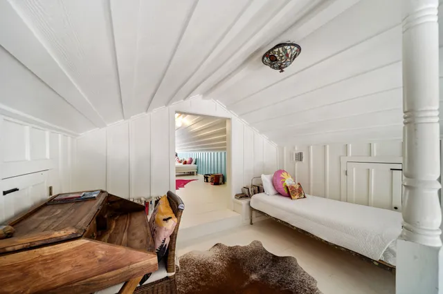 a kids room with toys and a rug