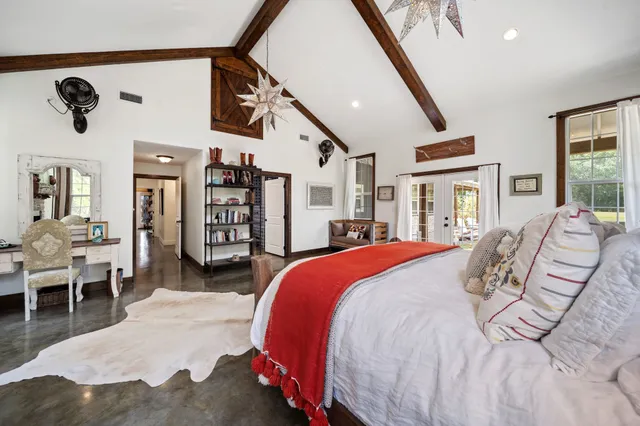 a bathroom with a bathtub sink mirror and toilet