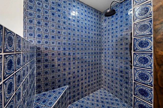 a bathroom with a bathtub and shower