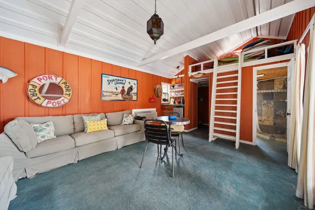 a aerial view of a house with swimming pool and lake view